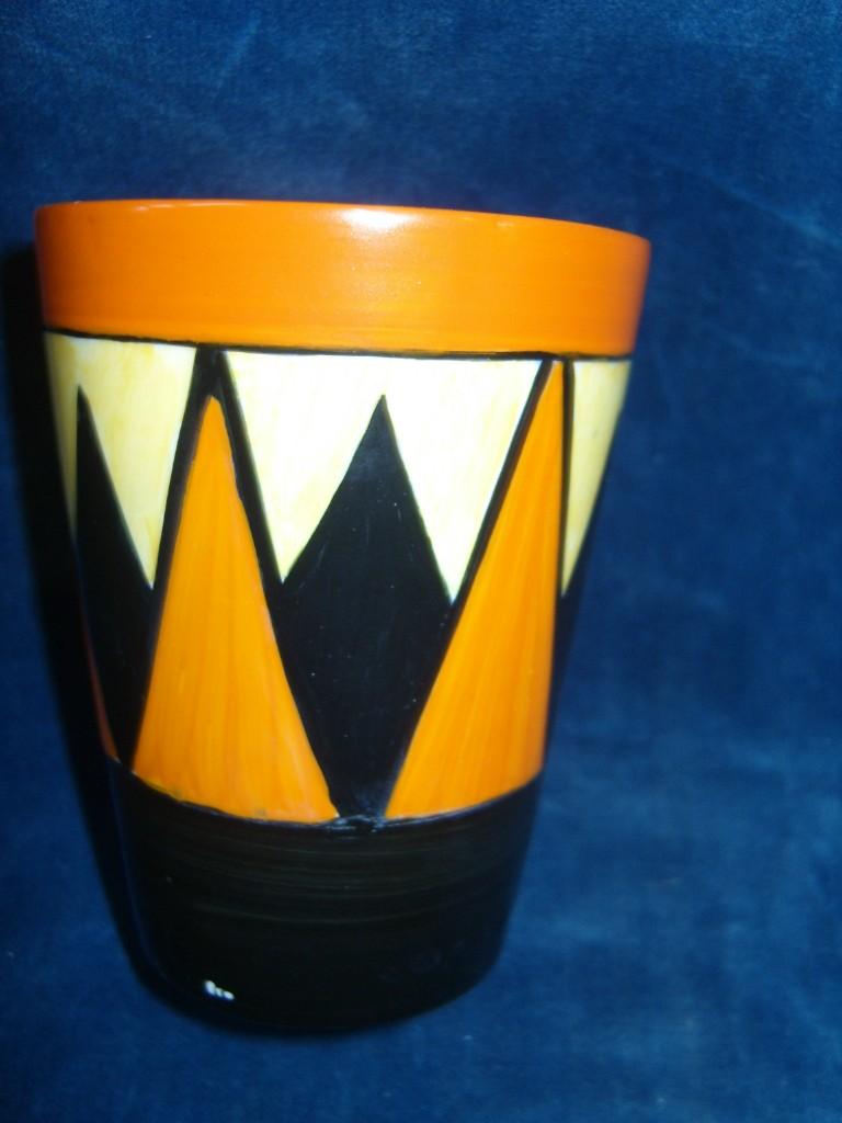 Appraisal: A Clarice Cliff beaker with painted geometric decoration in black