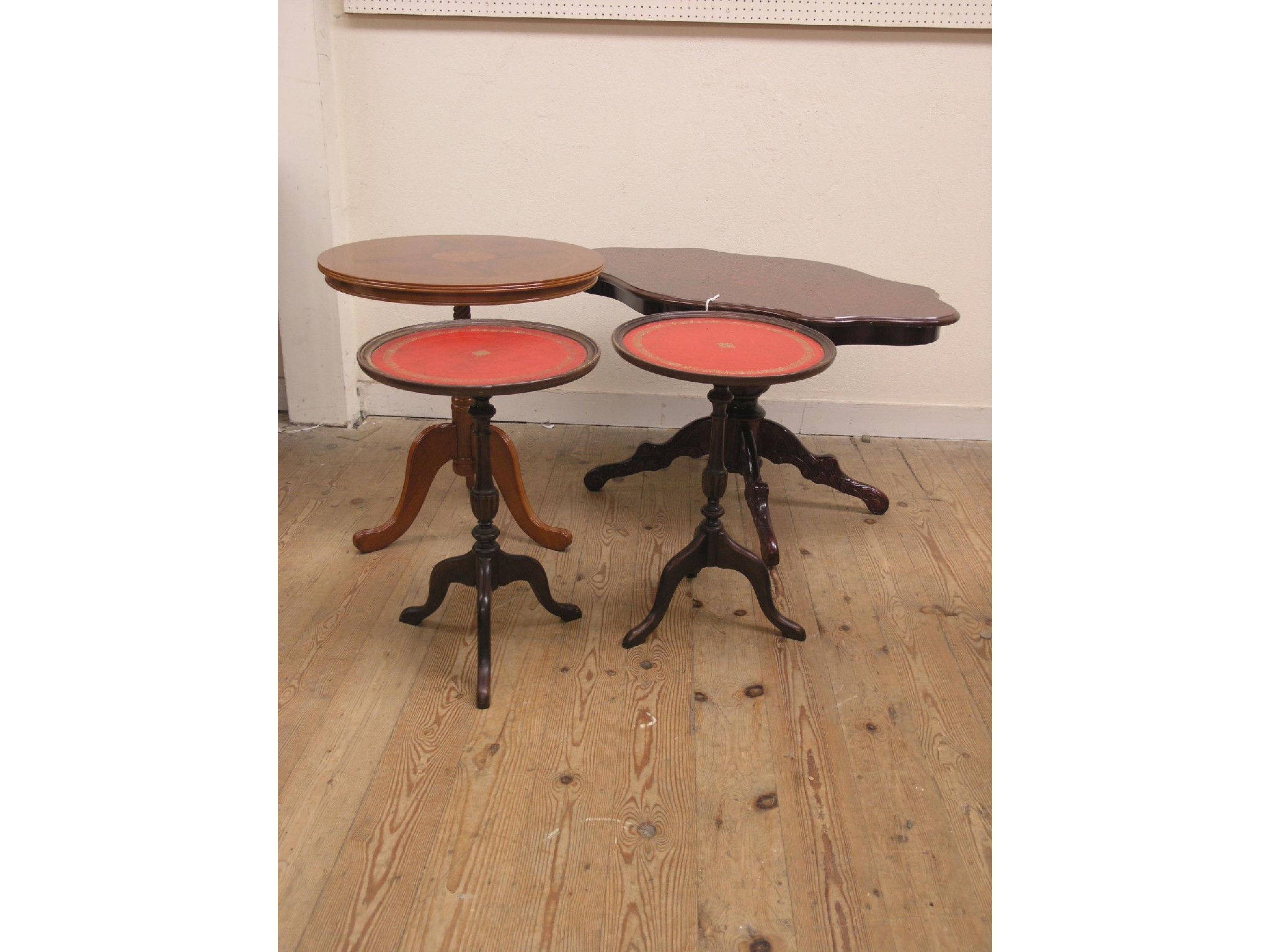 Appraisal: Two reproduction inlaid mahogany coffee tables each on pedestal stem