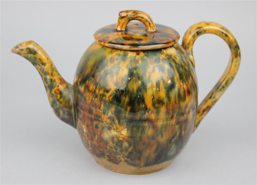 Appraisal: TORTOISE GLAZED STONEWARE TEAPOT AND COVER mid- th C illegible