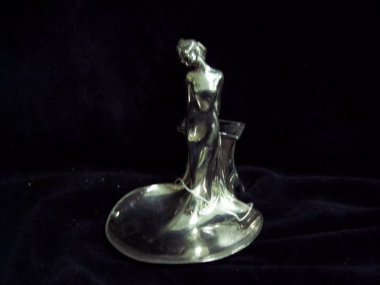 Appraisal: A chromium ashtray with the match holder to the back