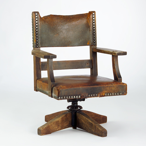 Appraisal: GUSTAV STICKLEY Office armchair with tacked-on leather seat and sling