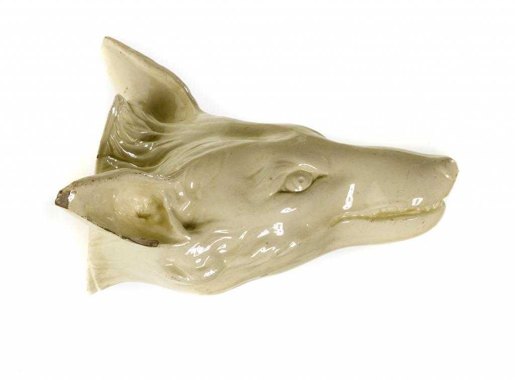 Appraisal: A CREAMWARE FOX'S HEAD STIRRUP CUP PROBABLY STAFFORDSHIRE crisply mounded