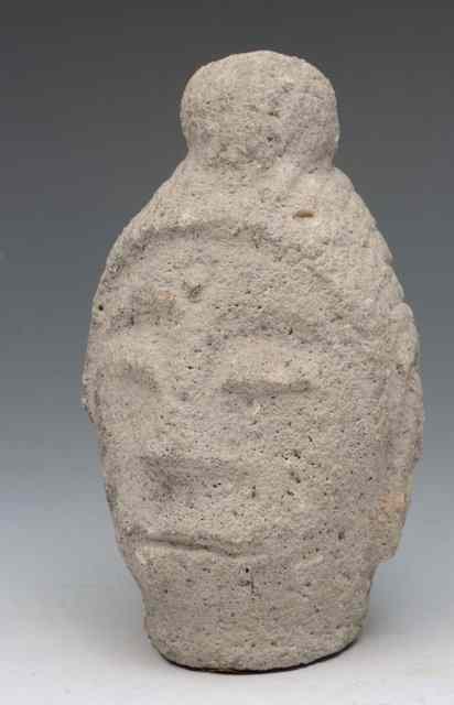 Appraisal: AN INDIAN CARVED STONE HEAD OF PALA high