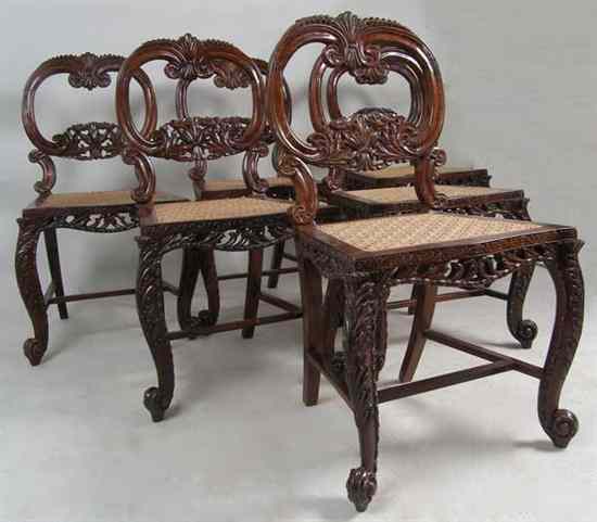 Appraisal: A Set of Six Anglo Indian Rosewood Caned Dining Chairs