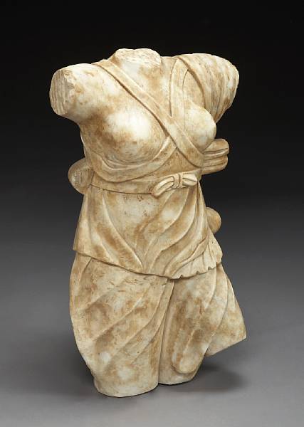 Appraisal: A carved marble torso of Aphrodite after the antique Depicted