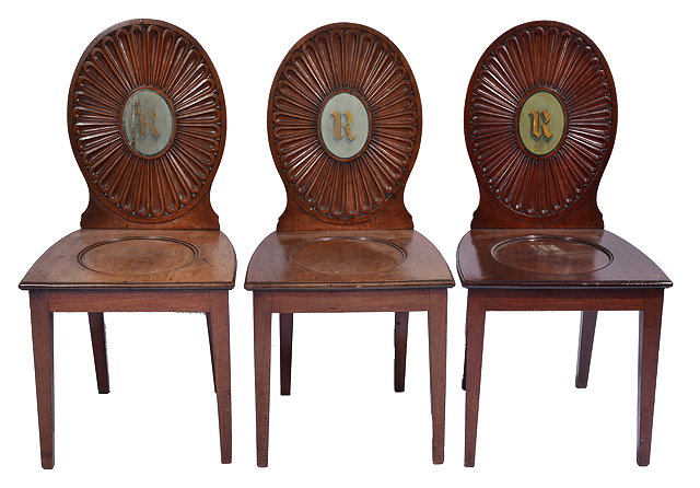 Appraisal: A SET OF THREE GEORGIAN MAHOGANY HALL CHAIRS each with