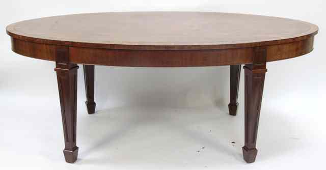 Appraisal: A mahogany breakfast table circa with oval satinwood banded top