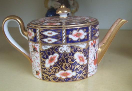 Appraisal: A Royal Crown Derby tea pot and cover decorated in