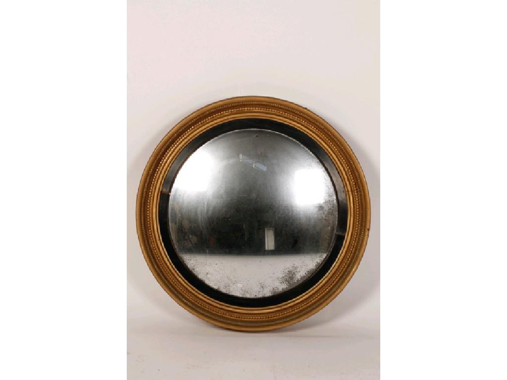 Appraisal: A REGENCY CIRCULAR GILTWOOD CONVEX WALL MIRROR the circular plate