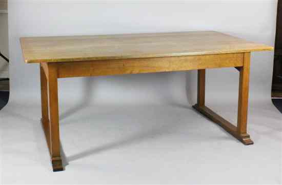 Appraisal: An Arts and Crafts golden oak dining table on square