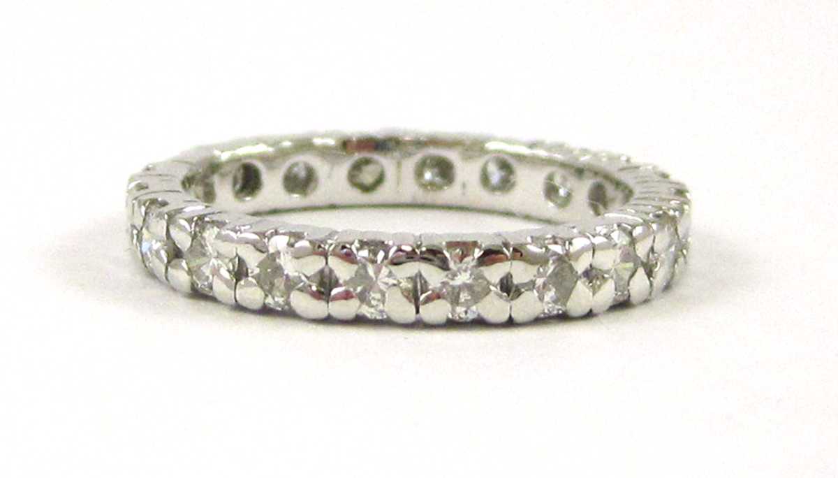 Appraisal: DIAMOND AND FOURTEEN KARAT GOLD ETERNITY RING The k white