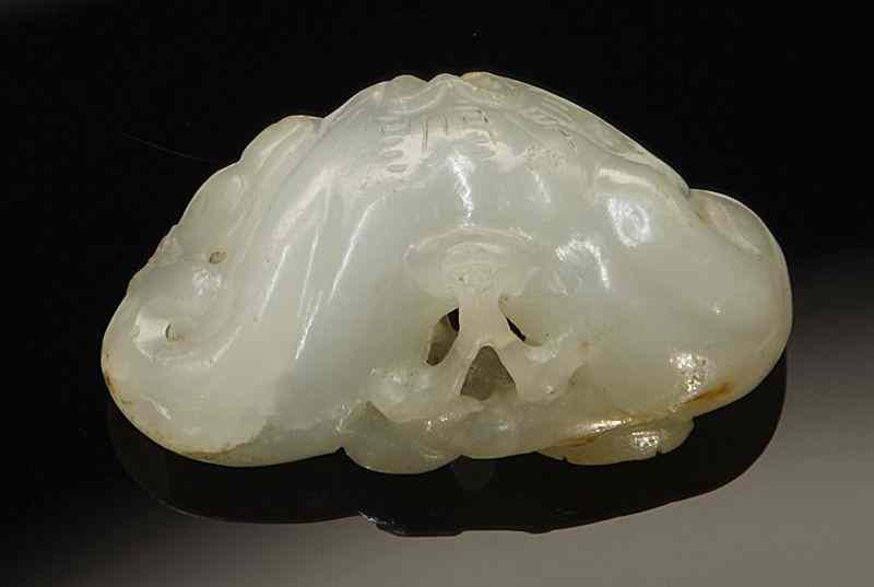 Appraisal: Chinese Qing carved white jade pendant depictingwater chestnuts and bats