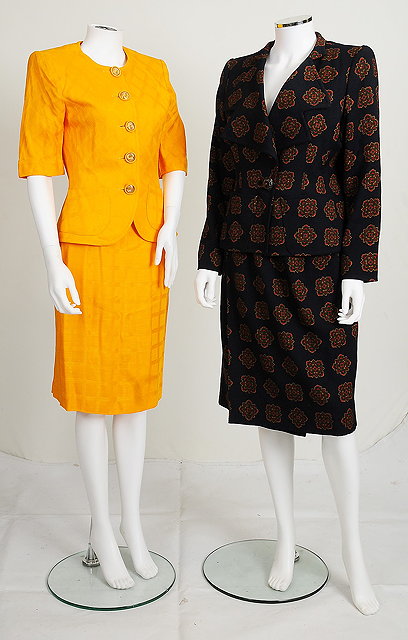 Appraisal: Two Yves Saint Laurent skirt suits one s navy with