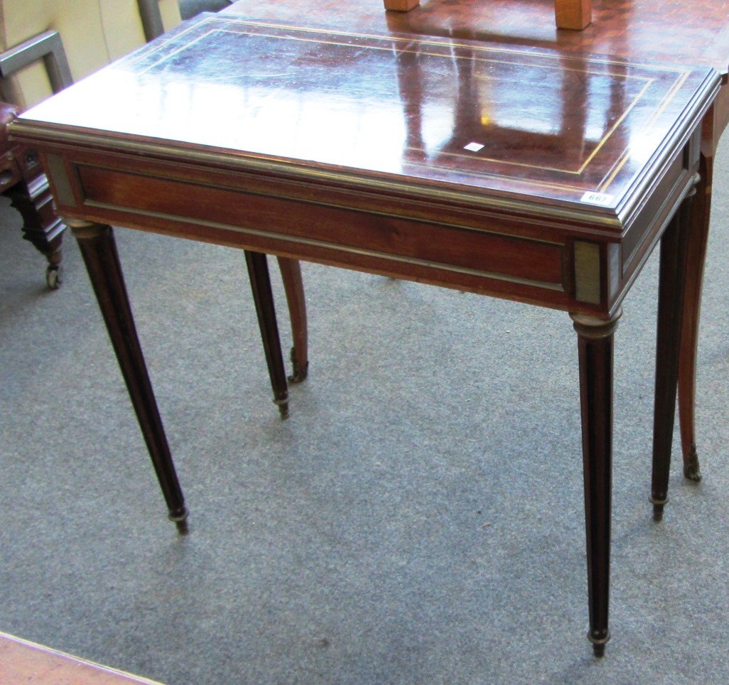 Appraisal: A Louis XVI style brass strung rectangular mahogany card table