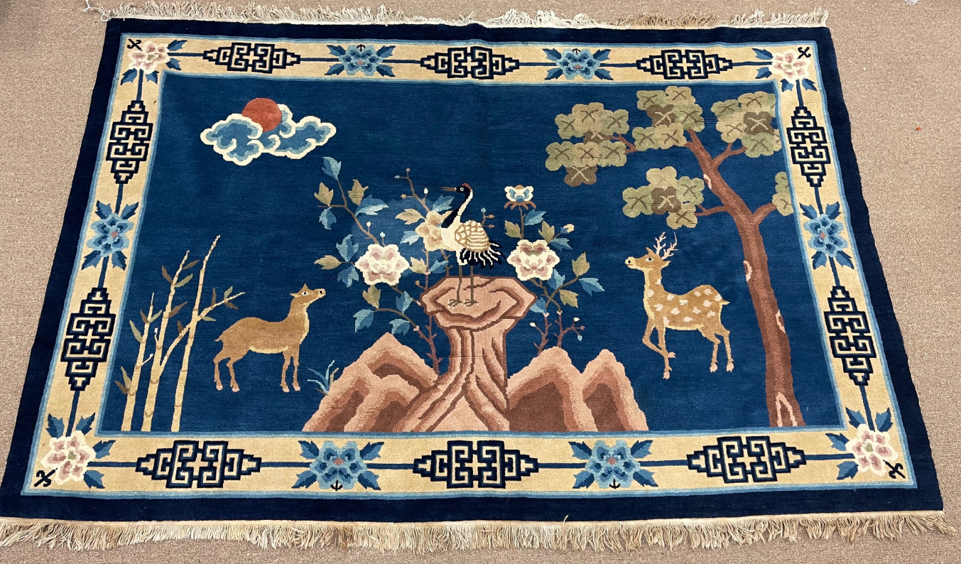 Appraisal: Chinese carpet depicting deers tree and flower plants issuing from