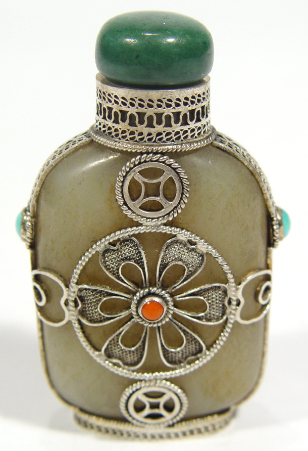 Appraisal: Chinese jade Tibetan style snuff bottle with green stone stopper