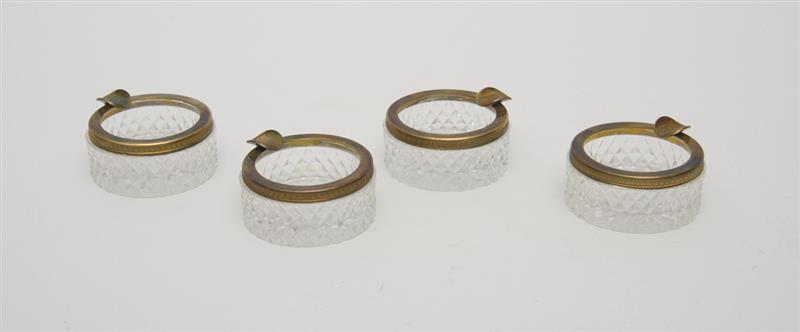 Appraisal: SET OF FOUR CARTIER CRYSTAL ASHTRAYS With silver bands in