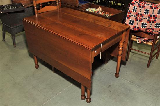 Appraisal: DROPLEAF DINING TABLE Cherry with rectangular leaves and turned legs