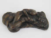 Appraisal: An erotic bronze paperweight of a couple in intimate embrace