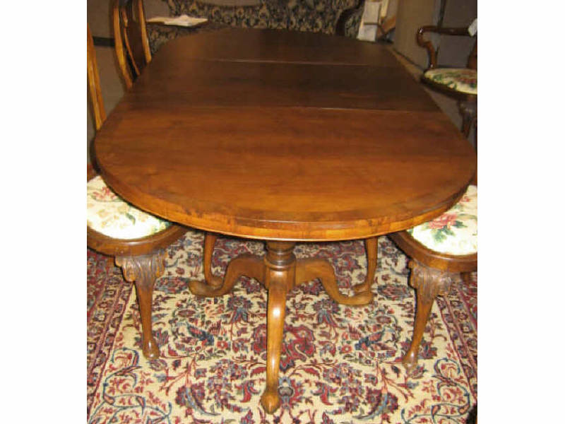 Appraisal: GEORGIAN STYLE WALNUT DINING TABLE Oval crossbanded top on twin