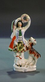 Appraisal: A Staffordshire figure of a Highland man with goat cmh