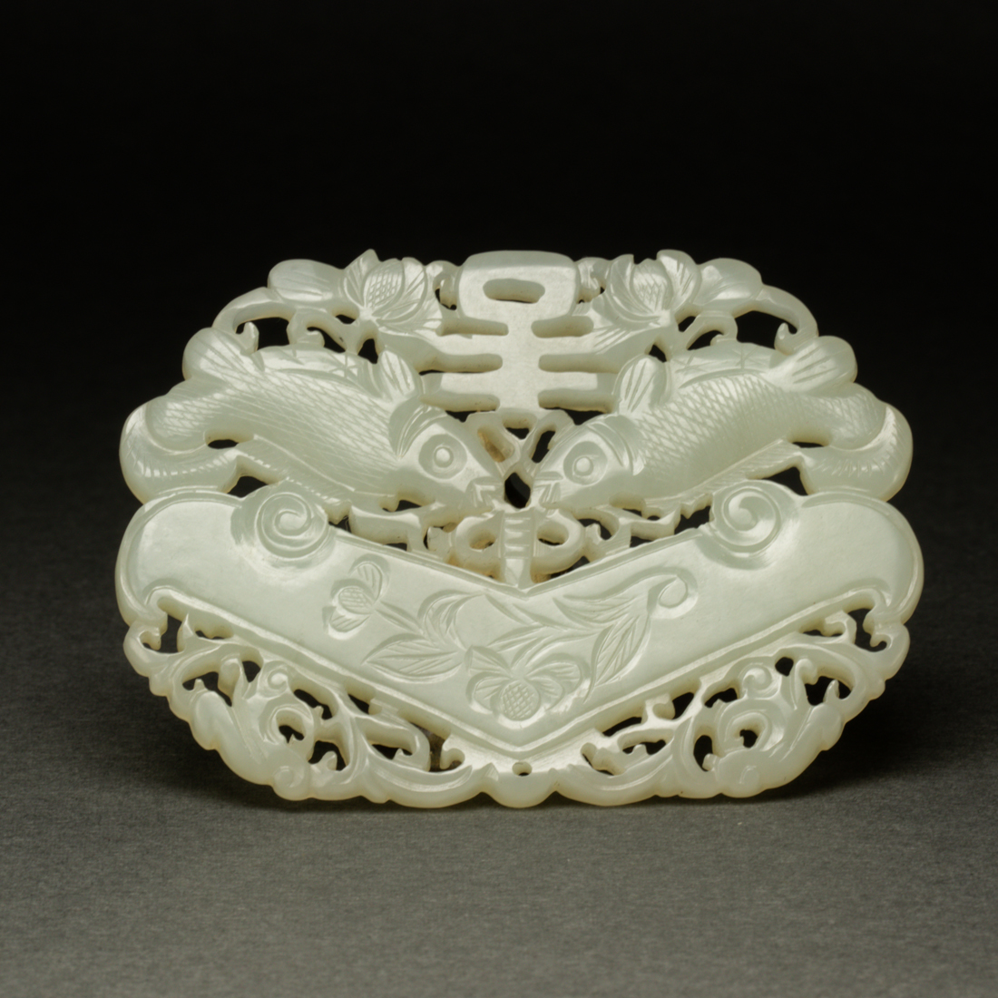 Appraisal: CHINESE WHITE JADE 'DOUBLE-FISH' PLAQUE Chinese white jade 'double-fish' plaque