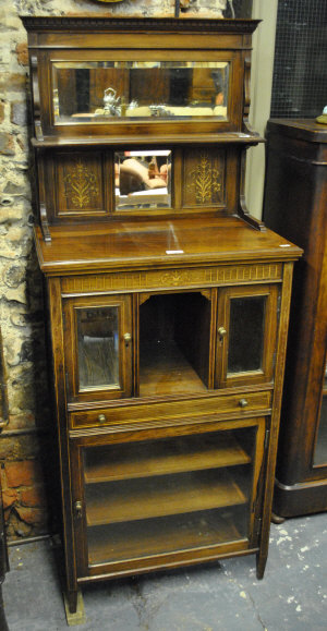 Appraisal: An Edwardian inlaid rosewood music cabinet with raised mirrored back