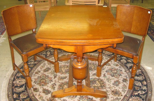 Appraisal: AN OAK DRAW-LEAF DINING TABLE AND CHAIR SET English mid