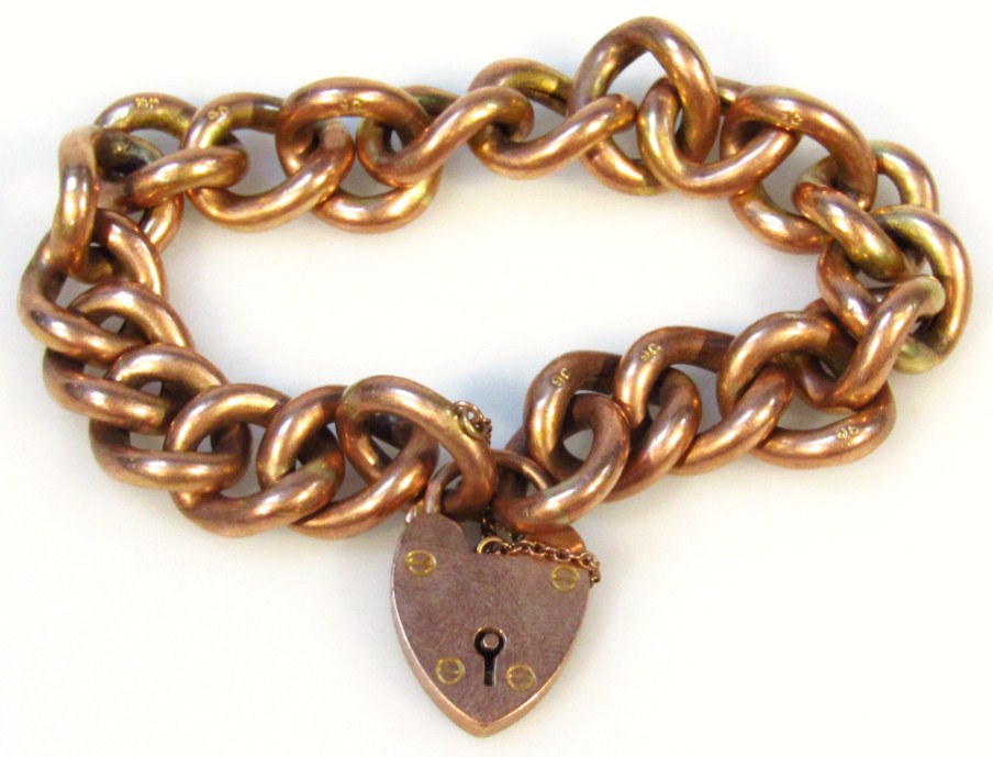 Appraisal: A ct gold heavy link bracelet with heart shaped clasp