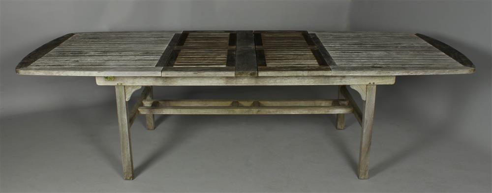 Appraisal: ROCKWOOD GRAY WEATHERED TEAK OUTDOOR EXTENDING DINING TABLE rectangular plank