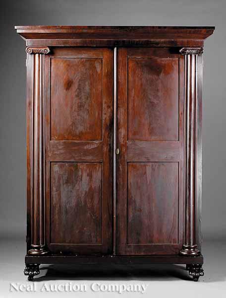 Appraisal: An American Classical Carved Mahogany Armoire c flared cornice with