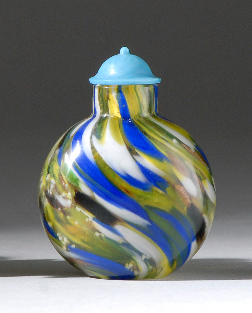 Appraisal: SWIRLED GLASS SNUFF BOTTLE Early th CenturyIn ovoid form with