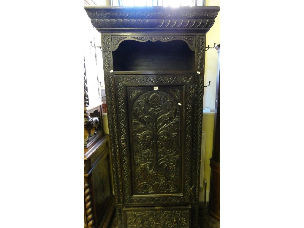 Appraisal: A Victorian carved oak hall cupboard with recessed top over