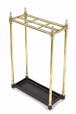 Appraisal: A turned brass six division stickstand with a cast iron