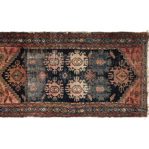 Appraisal: A Persian Wool Rug th Century feet inches x feet