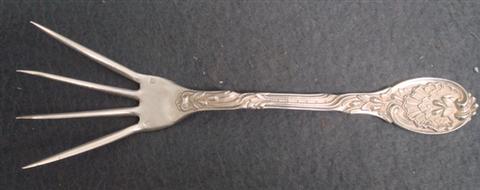 Appraisal: French silver tine fork with shell pattern handle l TO