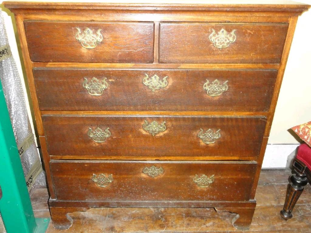 Appraisal: A Georgian oak two sectional chest fitted with an arrangement