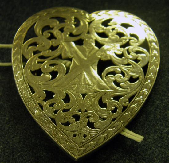 Appraisal: A SCOTTISH SILVER HEART-SHAPED BUCKLE pierced with the figure of