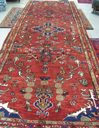 Appraisal: PERSIAN HALL CARPET northwestern tribal central medallion and overall floral