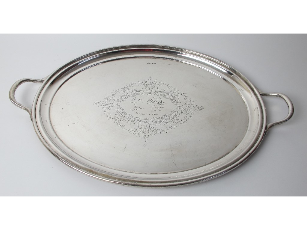 Appraisal: A silver two handled serving tray of oval form with