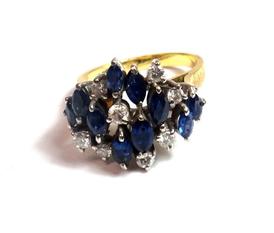 Appraisal: A gold sapphire and diamond set cluster ring claw set