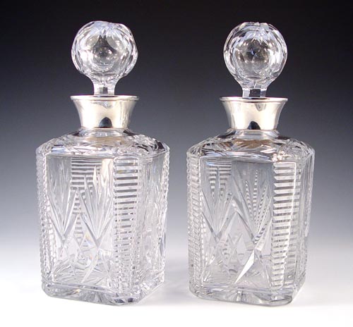 Appraisal: PAIR OF STERLING MOUNT CUT GLASS DECANTERS th century made