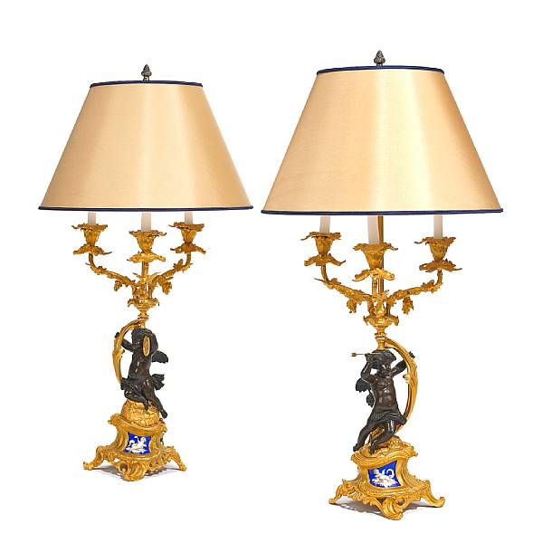 Appraisal: A pair of Napoleon III patinated and gilt bronze and