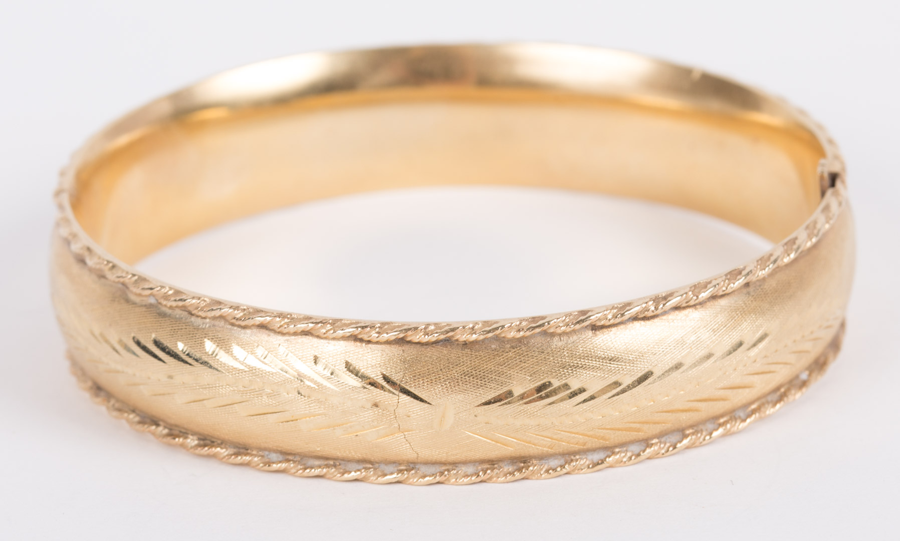 Appraisal: An Engraved Gold Bangle k size -