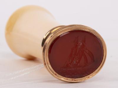 Appraisal: A gold seal the carnelian set a ship and with