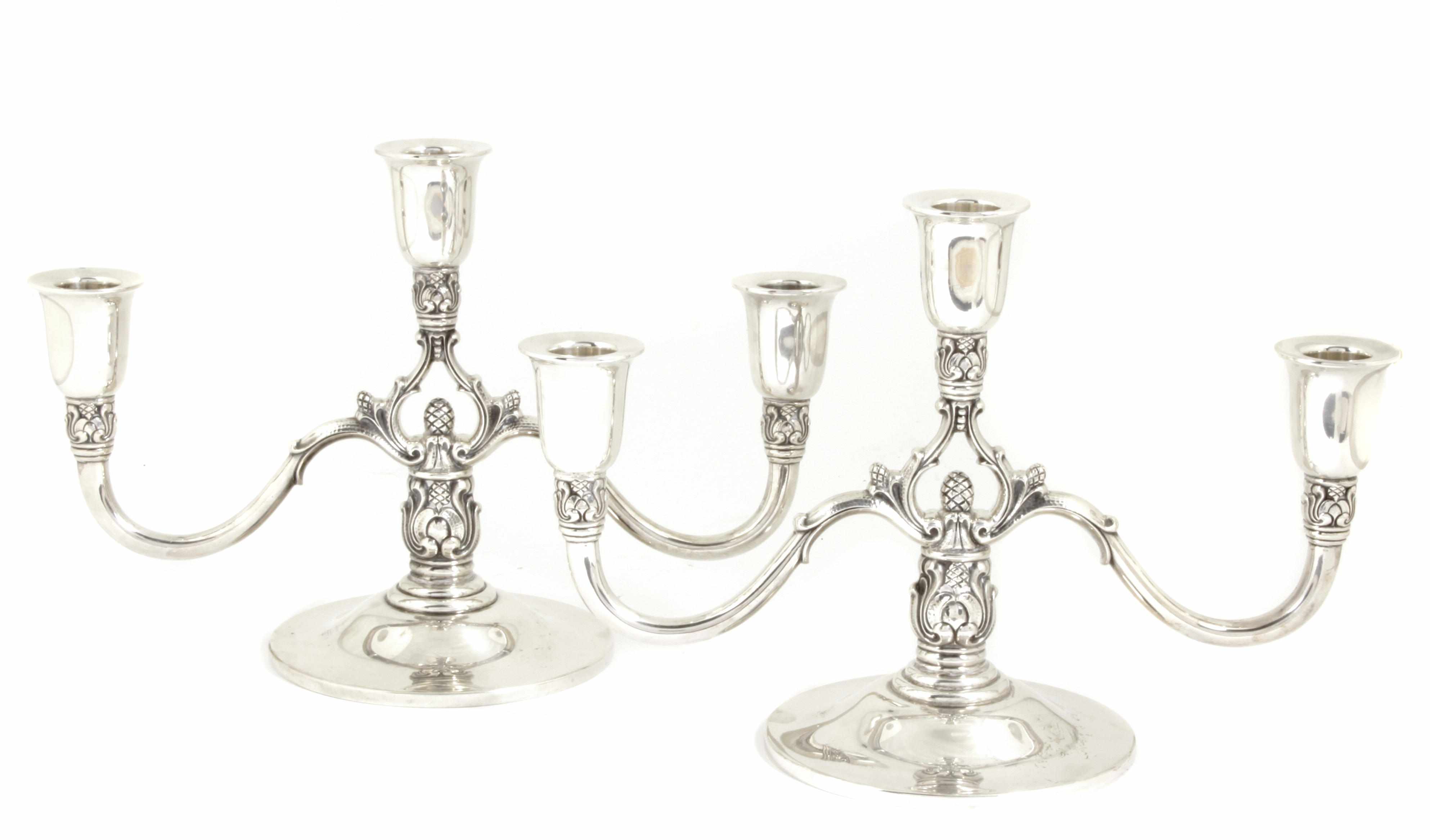 Appraisal: A pair of International Silver Co sterling silver three-light candleabra