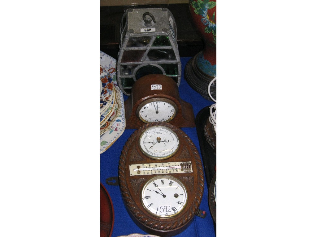 Appraisal: Lot comprising leaded glass lampshade a mantle clock and a