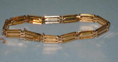 Appraisal: A CT GOLD GATE BRACELET with rose gold three bar