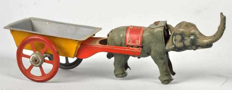 Appraisal: Tin Litho Elephant Pulling Cart Nickel Toy German Elephant's head