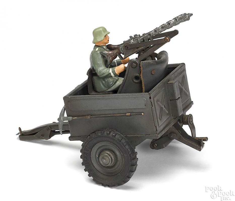 Appraisal: Hausser painted tin anti-aircraft military cart Hausser painted tin anti-aircraft